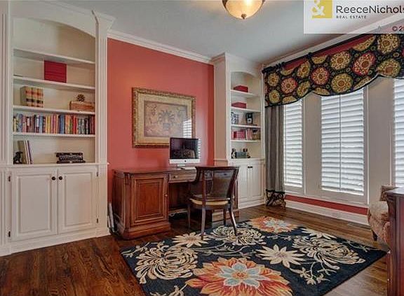Main floor Office w/ new hardwoods and built-ins.