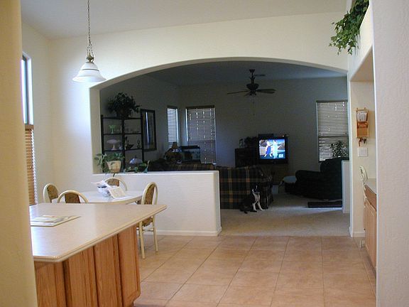 Spacious kitchen with large island and counter space on both sides of kitchen.