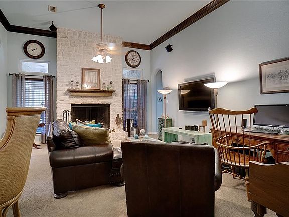 Living Room Features 12 ft. tall ceilings knotty pine crown molding
