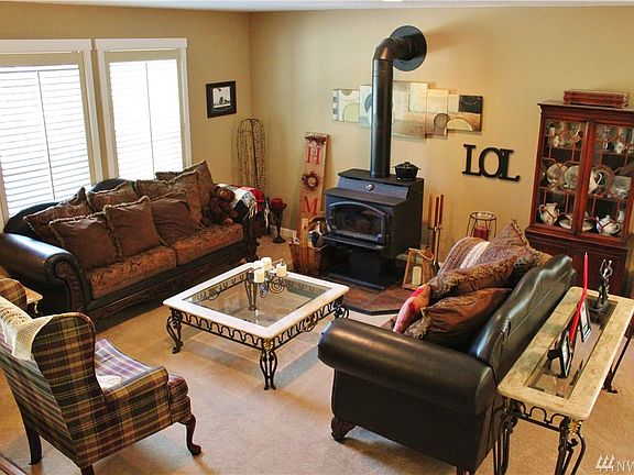 overlooking your front living space w/great natural light.  Home has a wood stove for those cold winter nights or if the power goes out during the winter.  Great flow thru home.