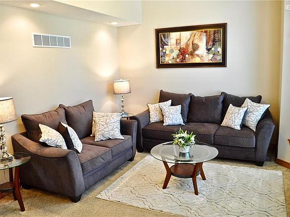 Formal Living Room with lots of natural light from floor to ceiling windows