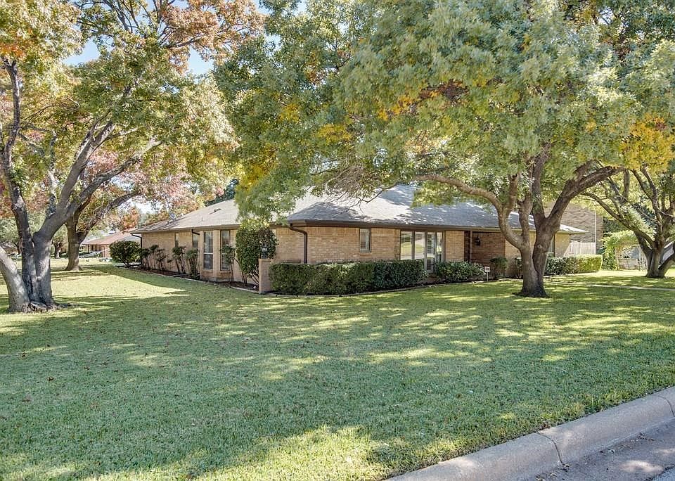 Gorgeous large corner lot features towering mature trees