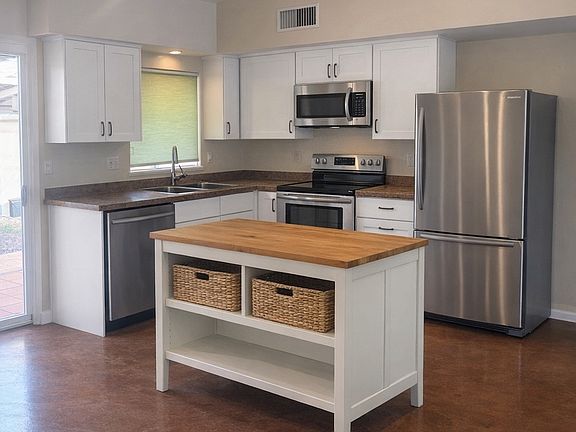 kitchen with moveable island provided by landlord