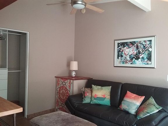 Washer//dryer unit in corner.