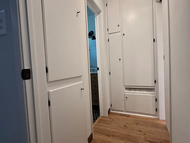 Hallway to bathroom from bedroom