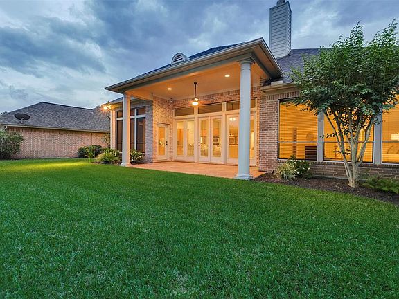 The views of the back of the home are beautiful! The large Covered Patio is great for Entertaining and for just relaxing. Enter it conveniently from the Breakfast Area and from the Master En-suite. Solar Screens have been added to the Back and Side o