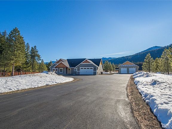 Asphalt drive leads to home and to shop.