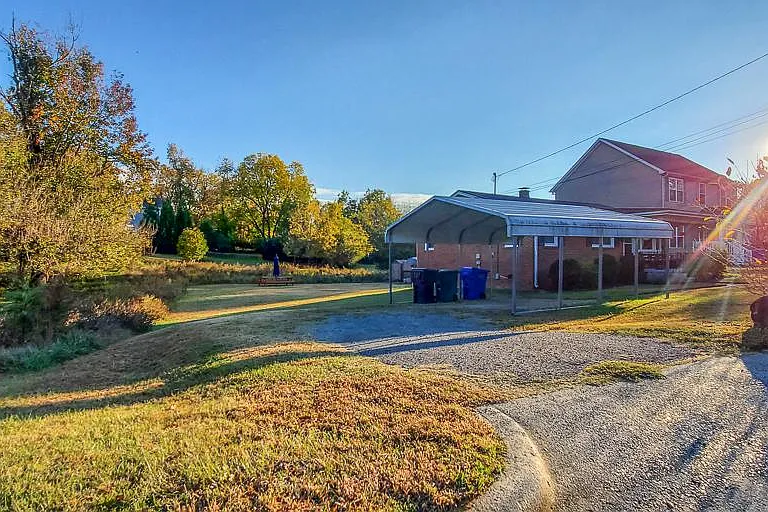 Driveway + 2-car Carport