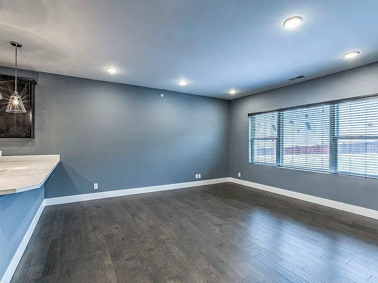 Expansive windows bring in natural light, enhancing the open and inviting feel.