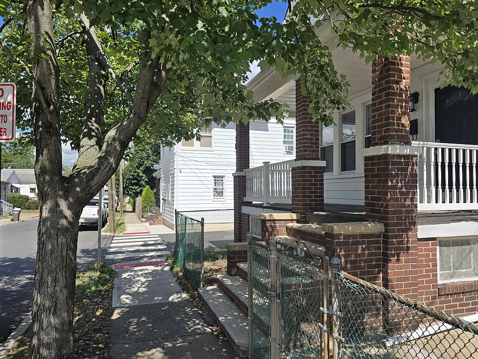 Masonry front steps to a covered porch.