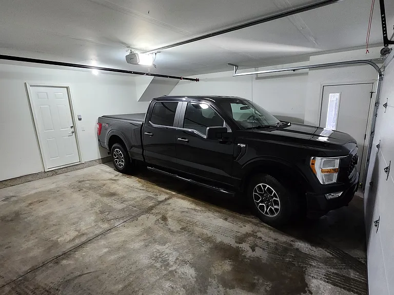 2 car attached garage included with 2 bedroom units. 20'-8" deep