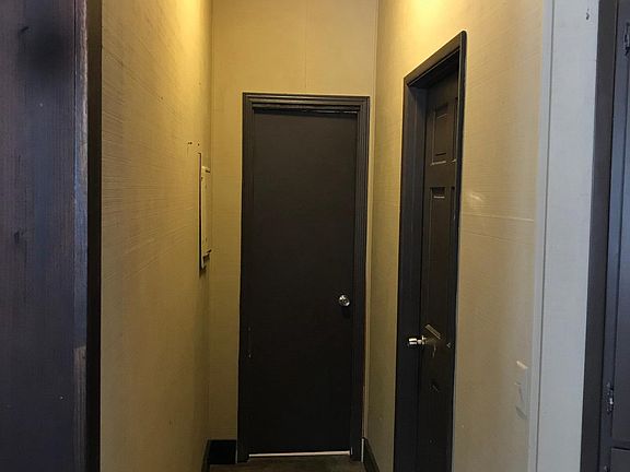 Hallway to full bath and laundry room/.5 bath