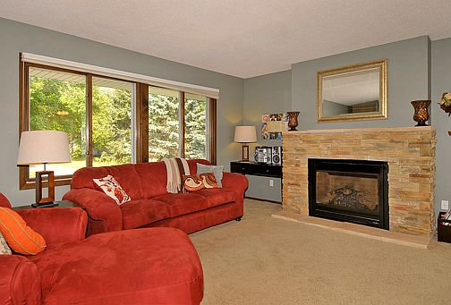 Custom stone faced gas FP anchors the LR with hidden runs for TV cords/cables