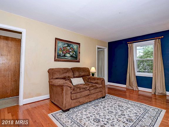 Spacious living room with gleaming hardwood floors