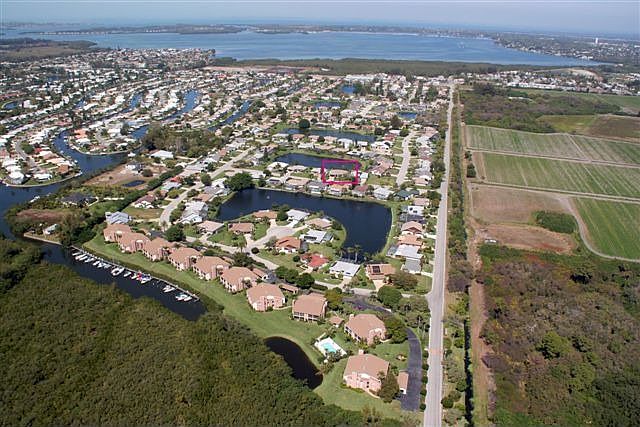 Home Boxed in Red Palma Sola Bay In Background