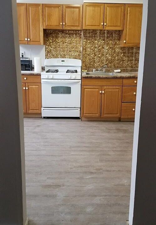 New flooring, charming original features. Spacious kitchen.