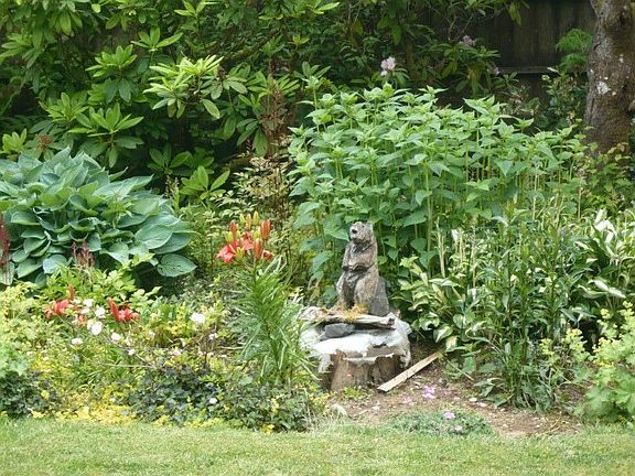 Abundant flower gardens and vegetable garden areas throughout the property. The property also featur