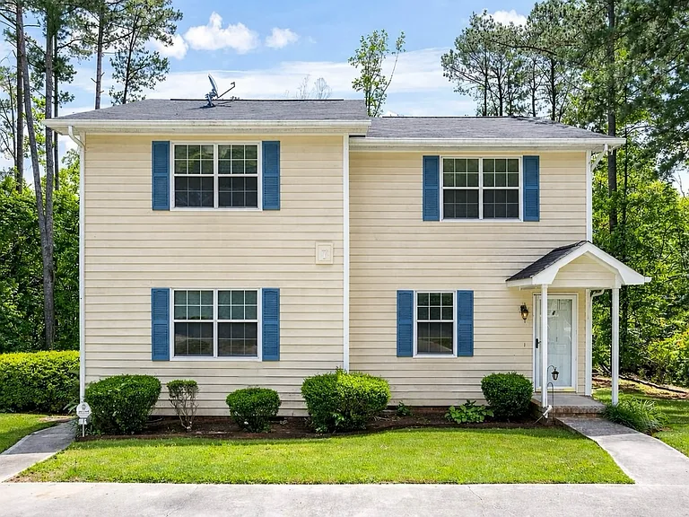 Charming duplex on a quiet cul-de-sac with convenient parking and a welcoming entry.