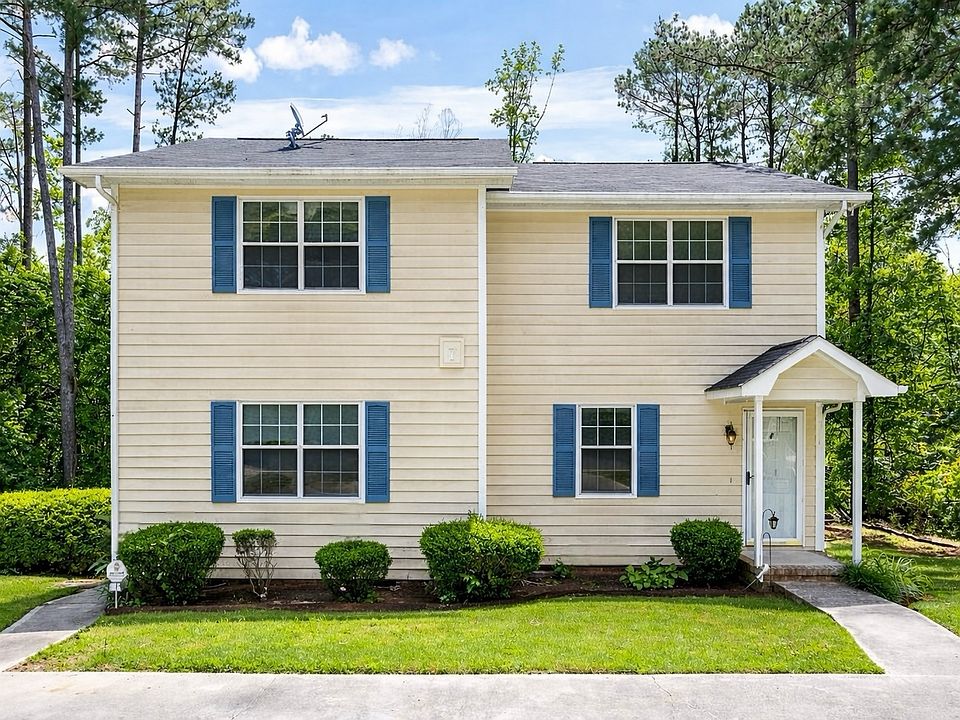 Charming duplex on a quiet cul-de-sac with convenient parking and a welcoming entry.