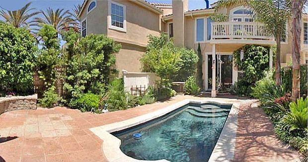 Private, heated pool in rear courtyard is perfect for entertaining.