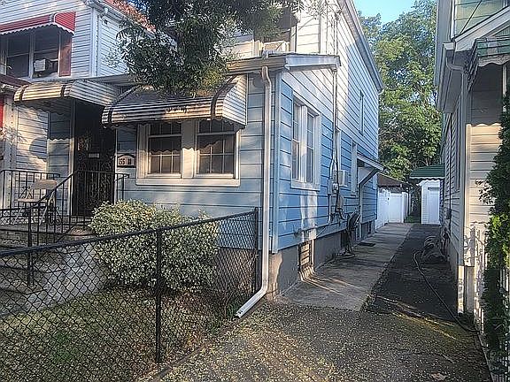 Side of house.  Shared drive