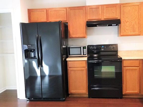 Spacious eat in kitchen with new appliances and pantry