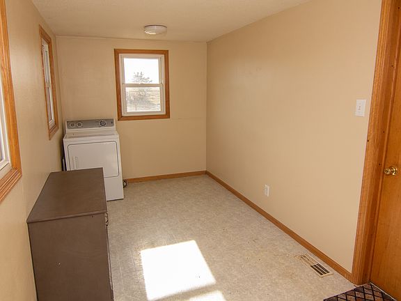 Large porch. flooring has been replaced with vinyl luxury plank same as living room flooring.