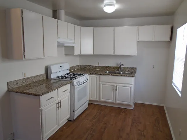 Kitchen With New Fridge and Gas Stove