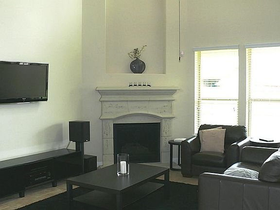 Spacious 2 story living area with corner stone fireplace!