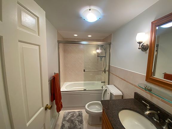 Bathroom with water jets in the bath tub.