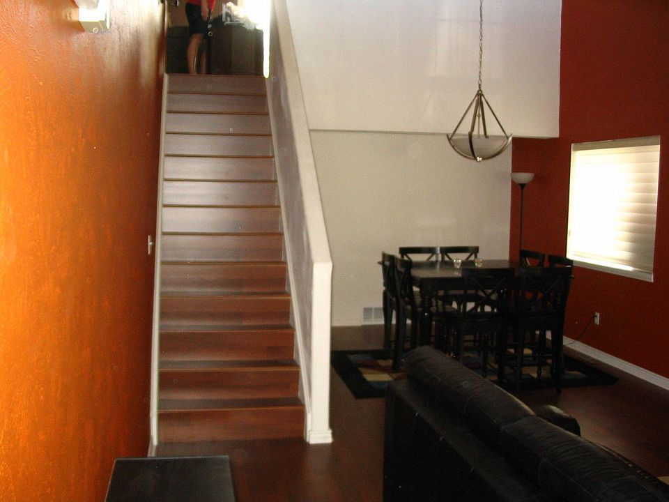 Walking into the house.