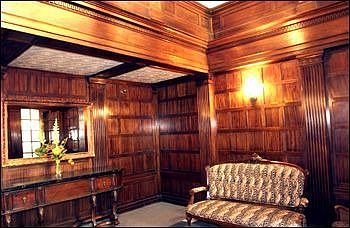 Mahogany wainscoting decorates the foyer
