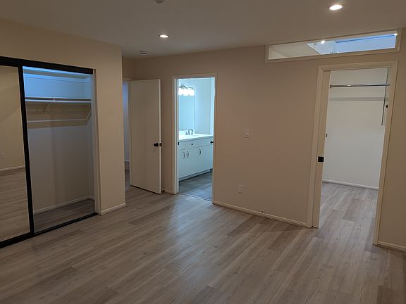 Master bedroom with side closet (L) and dressing room (R)