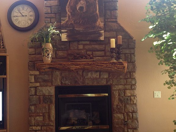 Stone front w/wood mantel