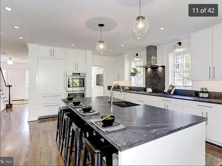 Modern kitchen with stainless steel appliances and ample storage
