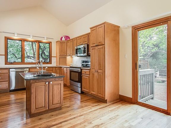 AFTER: Living/Dining Area with the wallpaper border now removed...neutral paint color; ready for any style decor!