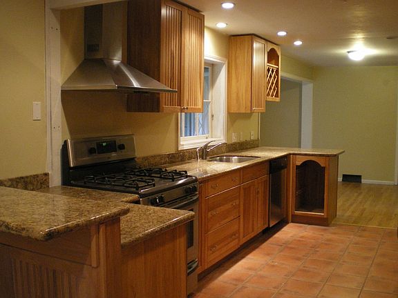 Gourmet kitchen with new cabinets and granite counters.