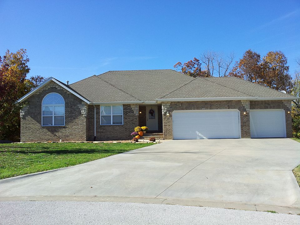 All brick 3 car garage walkout