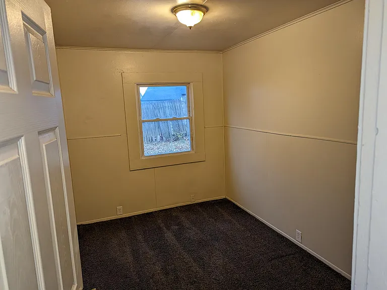 Another view of bedroom by living room