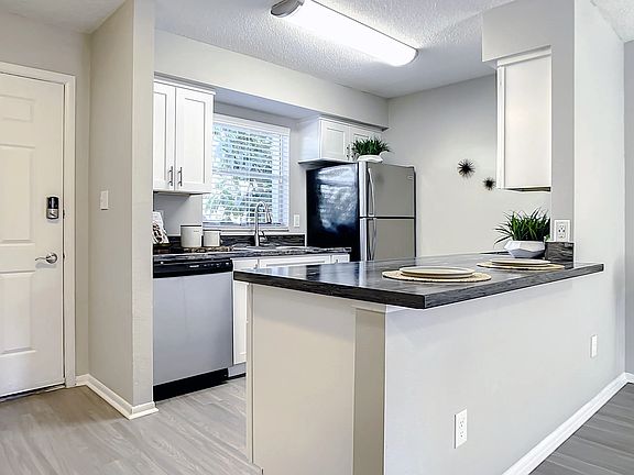 Select floor plans feature kitchens with spacious, open breakfast bars - a host's dream for gatherings and good times.
