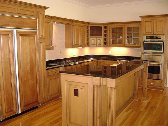 KITCHEN ALSO HAS CANNED LIGHTING, TILE BACKSPLASH, HARDWOODS AND GRANITE TOPS