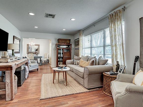 Light and bright living room with lots of windows and recessed lights. 5 extra storage closets in house!