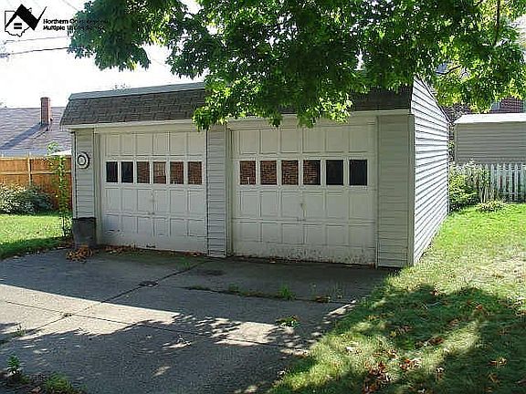 Spacious cement driveway with 2 car garage
