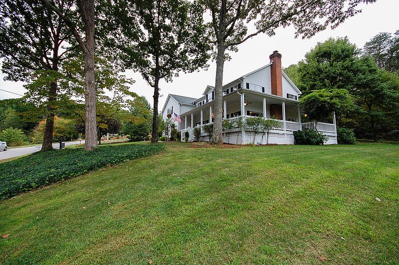 Happily situated!
						:
						Mature oak, dogwood, and maple trees. Wrap around porch.