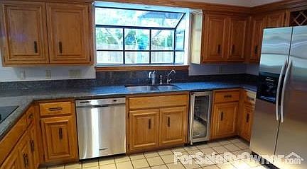 Kitchen : Cobalt black granite, bay window, kitchen aid dish washer, viking wine fridge
