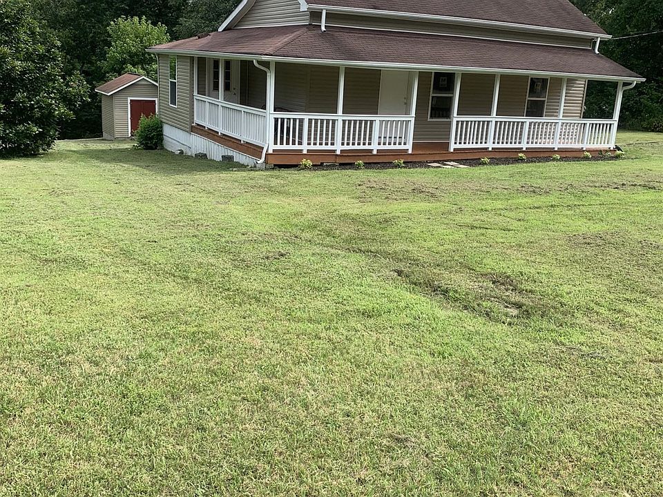 Beautifully situated on 1.90 acre level with nice trees.