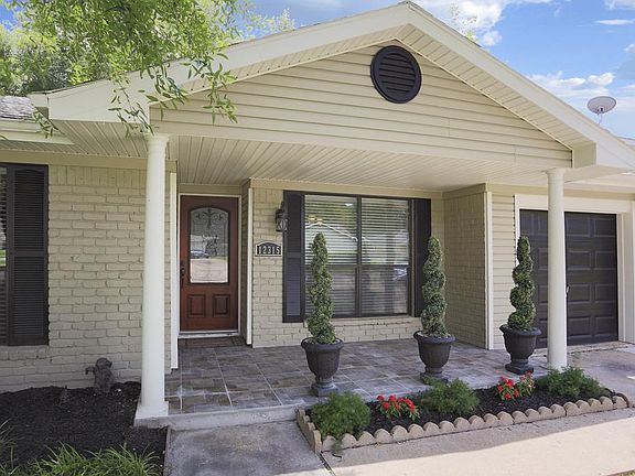 Stoned tile flooring recently added to over-sized porch