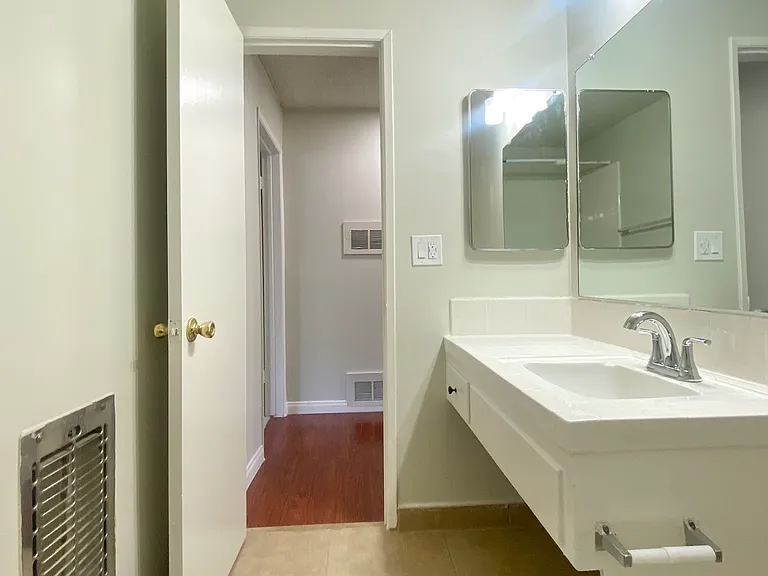 Main bathroom view of vanity and medicine cabinet