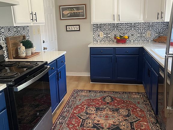 Kitchen with new appliances, backsplash, quartz countertips, stainless refrigerator, LVT flooring