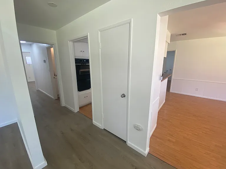 Hallway with ample storage (coat closet, linen closets).